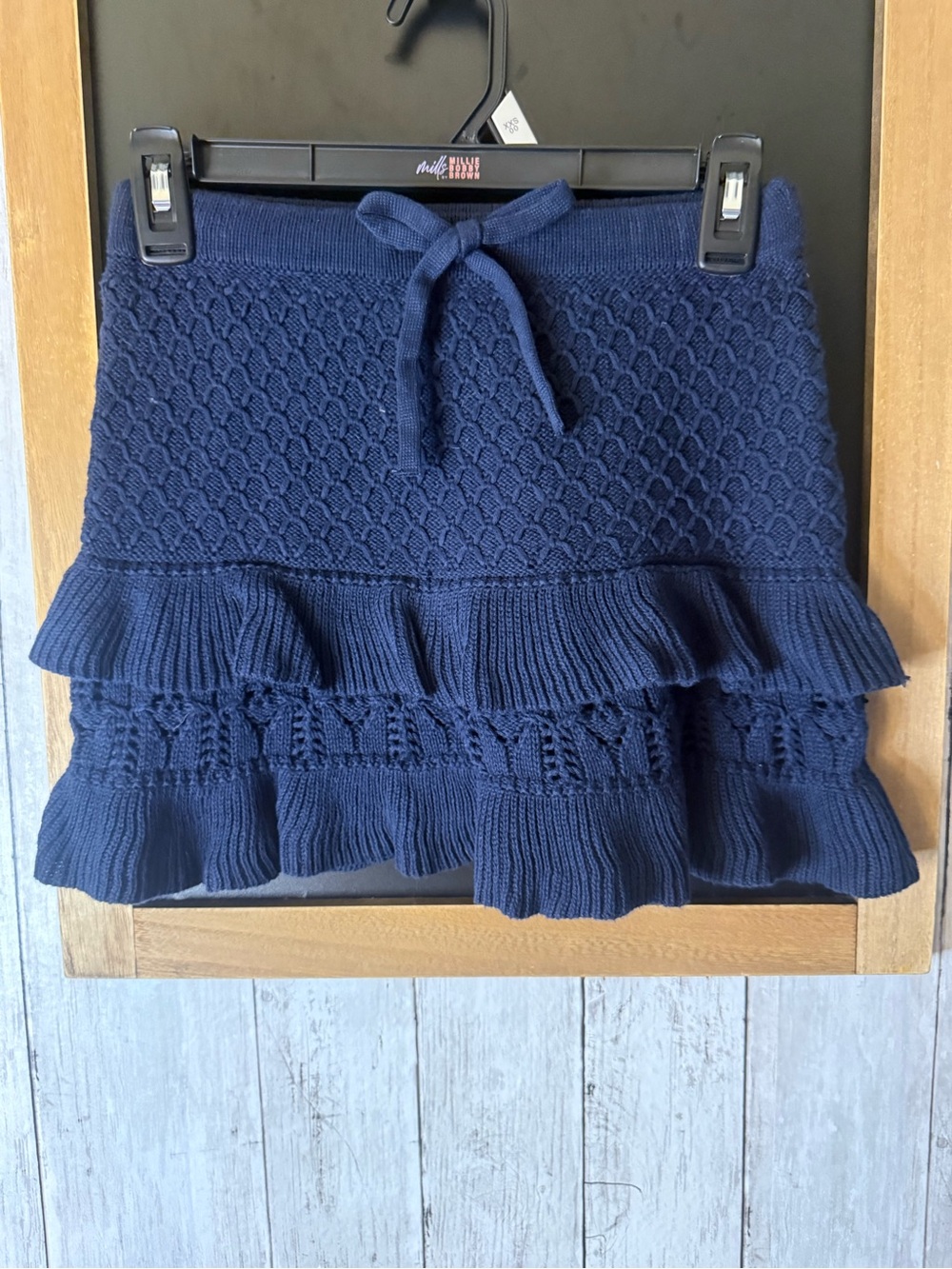 NWOT Millie Navy blue ruffle w bow knit mini skirt with tie waist,
